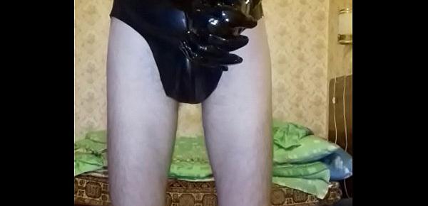  Guy in latex mask and latex shorts, vinyl pants and gloves